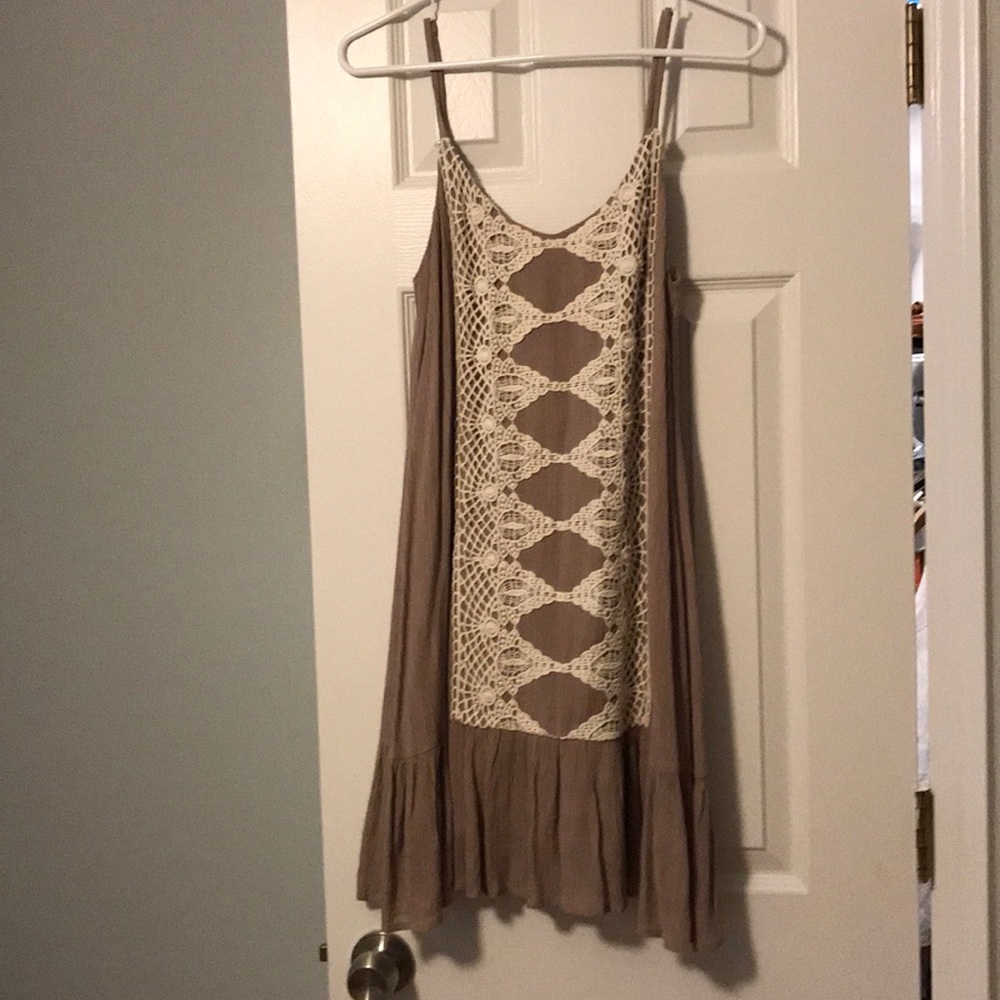 Dress with lace detail and ruffled hem.